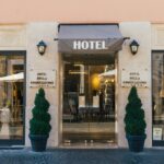 Explore the elegant entrance of Hotel Della Conciliazione, located in the heart of Rome, Italy.