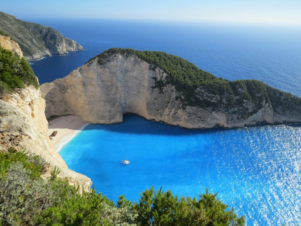 A breathtaking view of Navagio Beach with azure waters surrounded by cliffs in Greece.